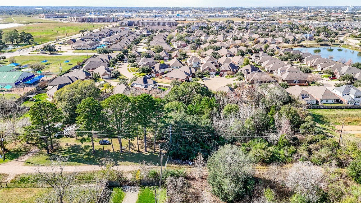 1021-1033 Roesner Road Katy, TX 77494 - Photo 21 of 29 an aerial view of residential houses with outdoor space and trees