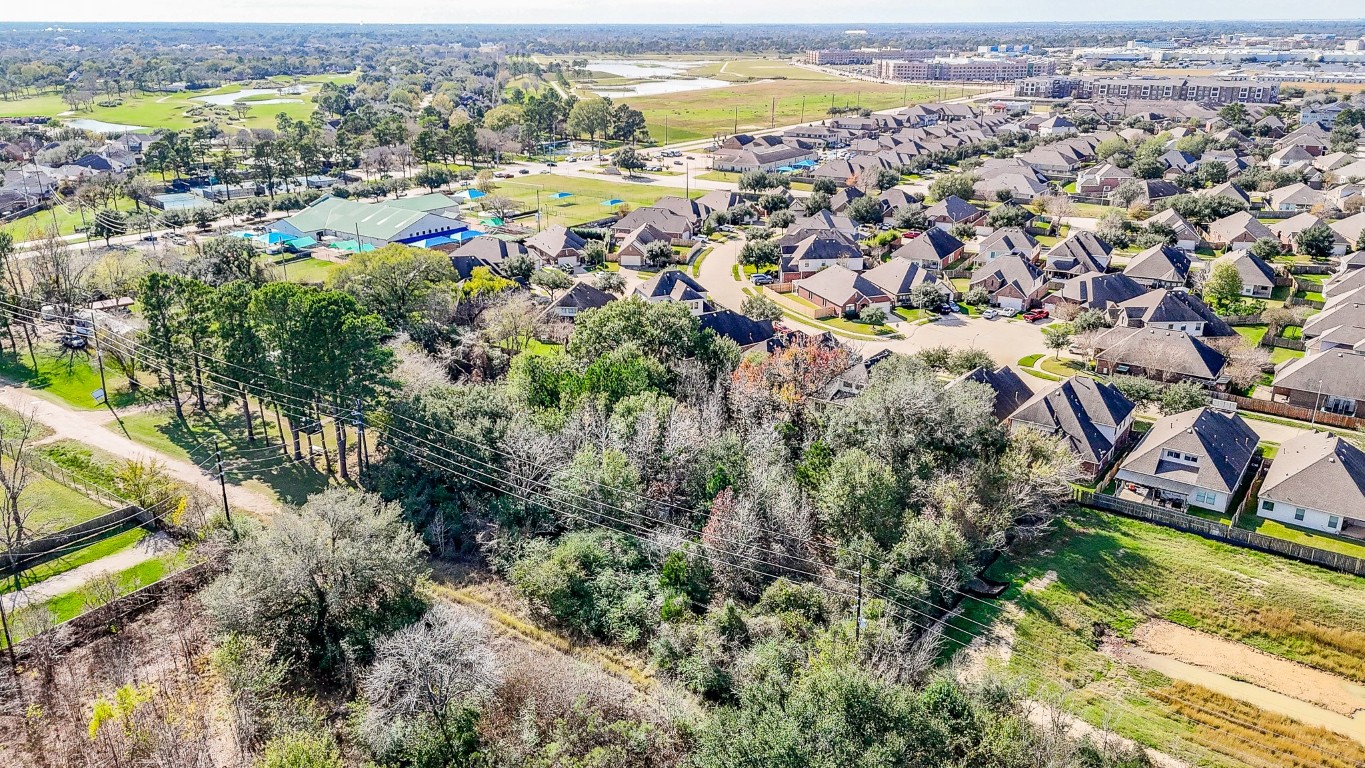 1021-1033 Roesner Road Katy, TX 77494 - Photo 22 of 29 an aerial view of residential houses with outdoor space and swimming pool