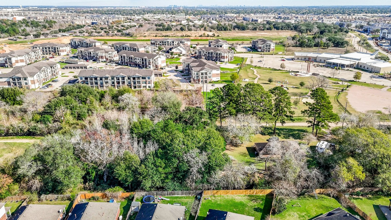 1021-1033 Roesner Road Katy, TX 77494 - Photo 23 of 29 an aerial view of residential houses with outdoor space and swimming pool