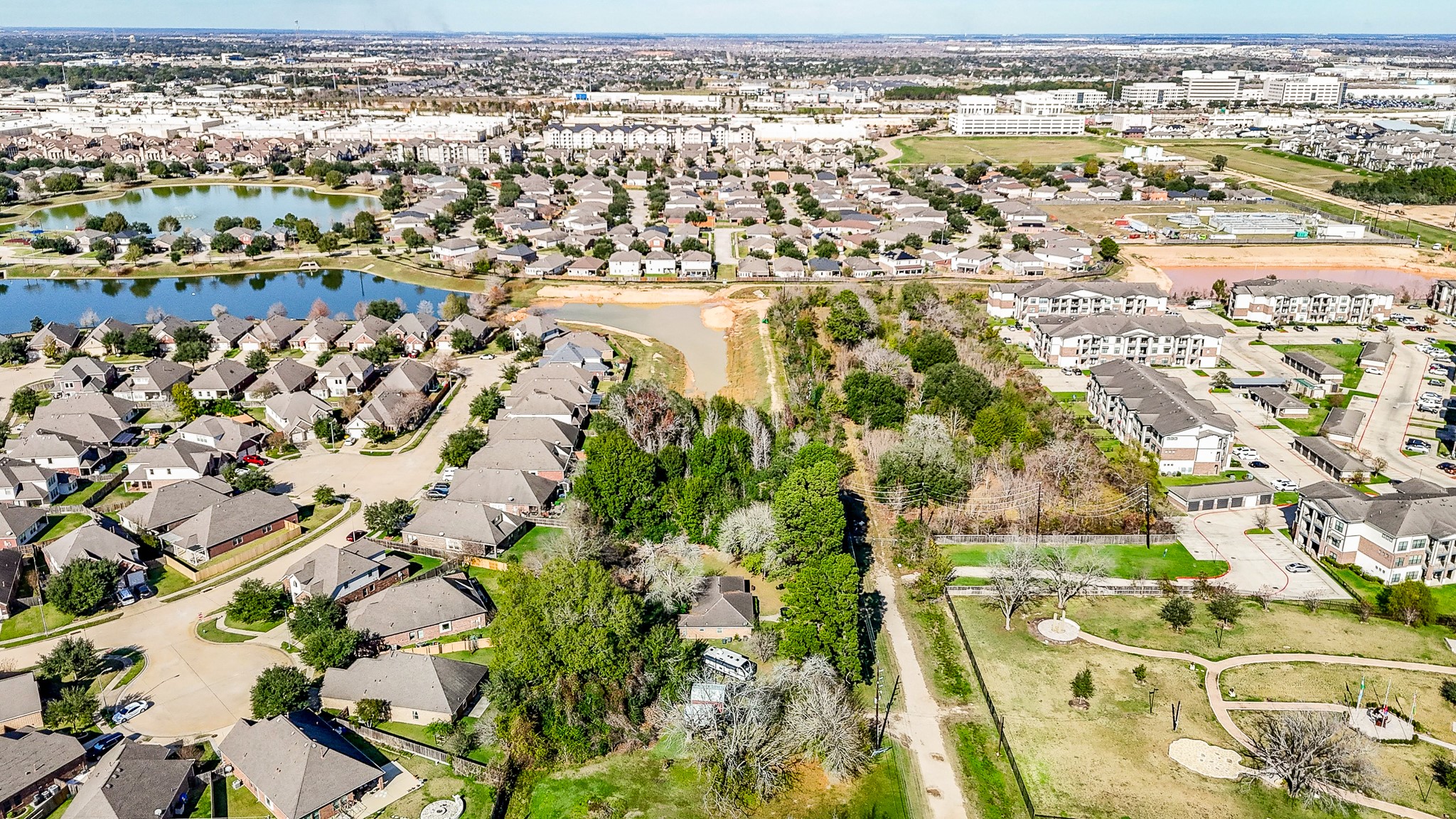 1021-1033 Roesner Road Katy, TX 77494 - Photo 25 of 29 an aerial view of residential building with parking space