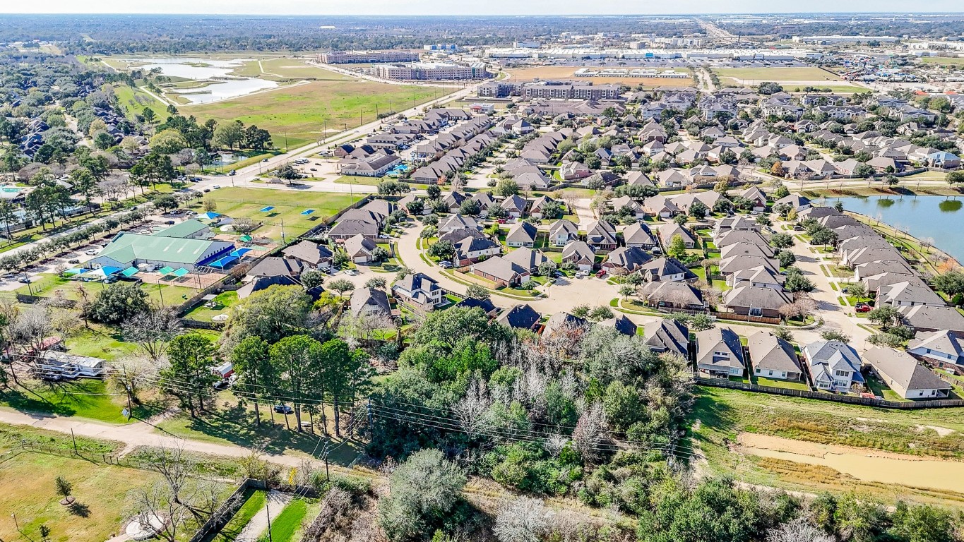 1021-1033 Roesner Road Katy, TX 77494 - Photo 26 of 29 an aerial view of residential houses with outdoor space and swimming pool