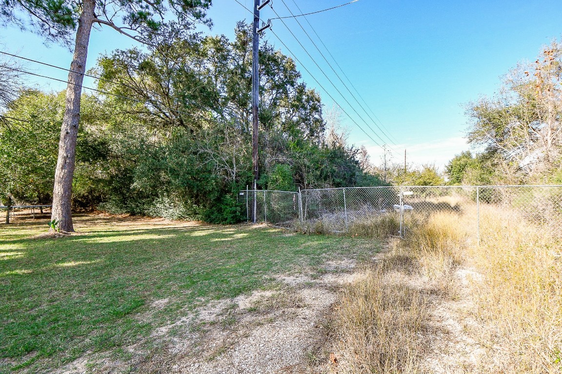 1021-1033 Roesner Road Katy, TX 77494 - Photo 29 of 29 a backyard of a house with lots of green space and fountain