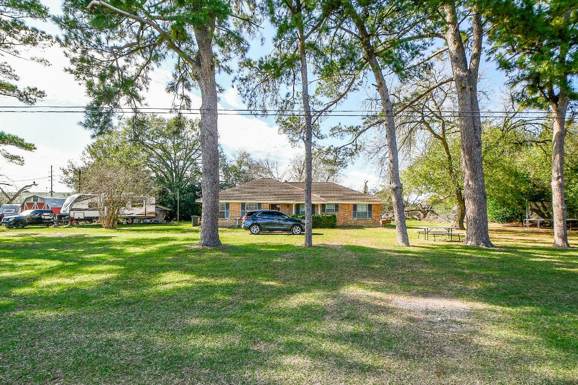 1021-1033 Roesner Road Katy, TX 77494 - Photo 3 of 29 a view of a park with large trees