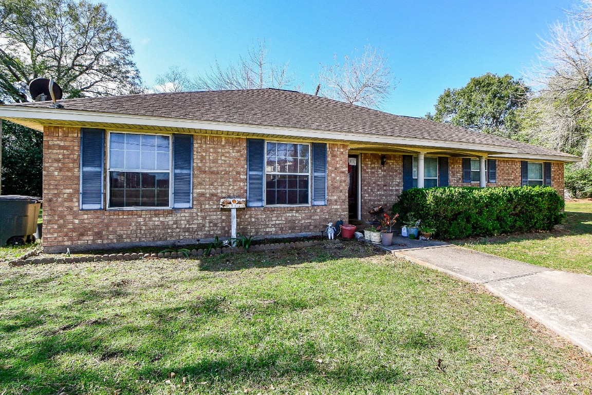 1021-1033 Roesner Road Katy, TX 77494 - Photo 5 of 29 front view of a house with a yard