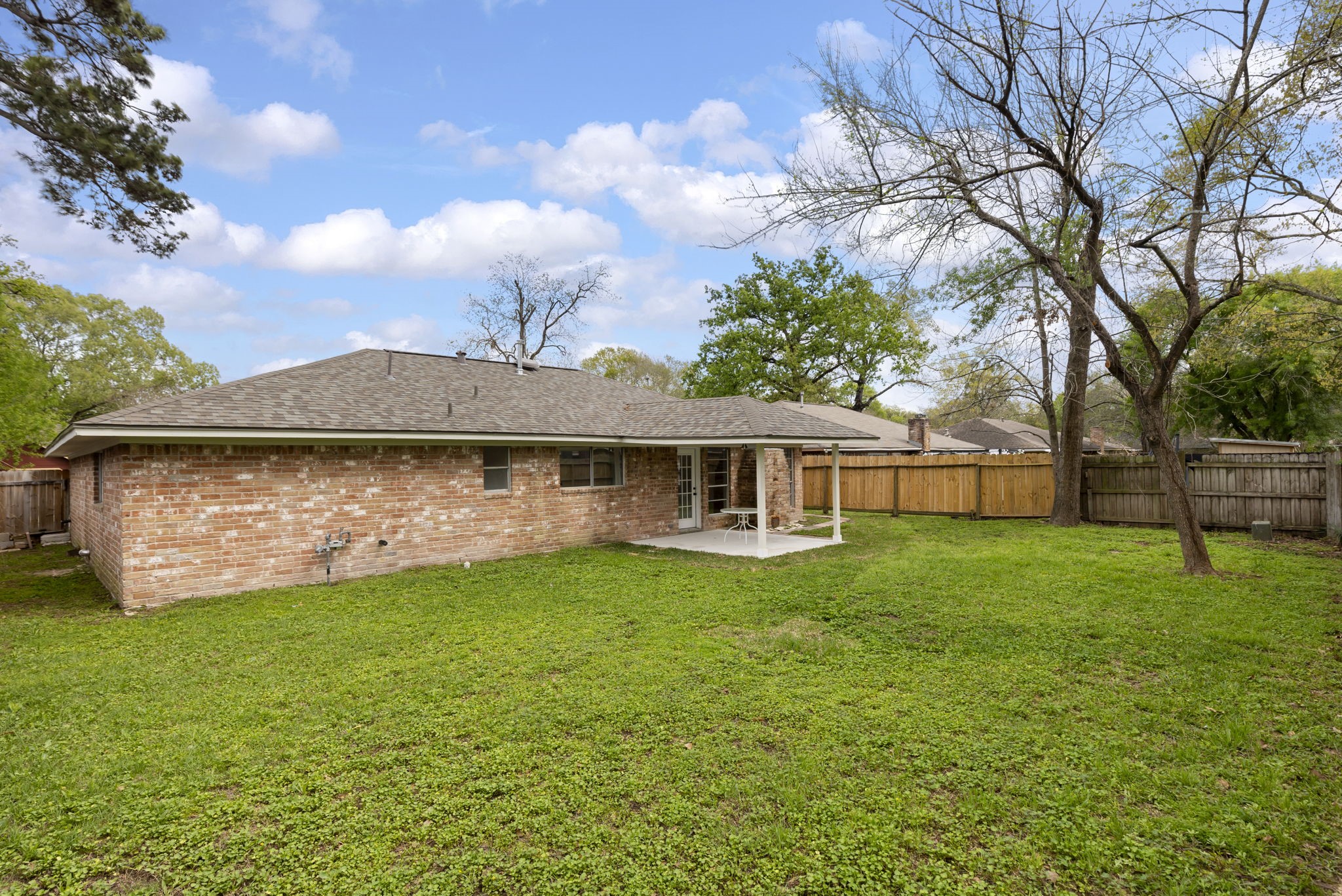 29107 Binefield Street Spring, TX 77386 - Photo 15 of 18 Large green space, BRICK ON ALL FOUR SIDES for low maintenance, plus charming paver walkway to the side gate!