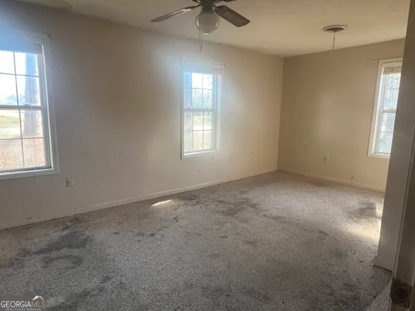 a view of an empty room with a window