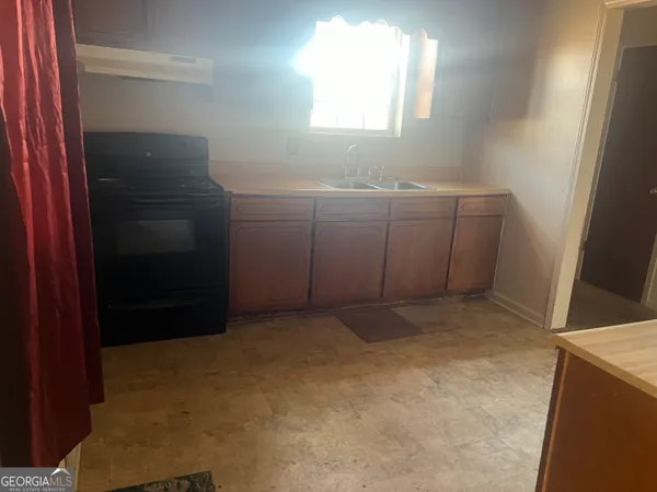 a view of an empty room with windows