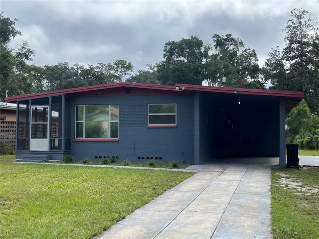 a view of house with yard