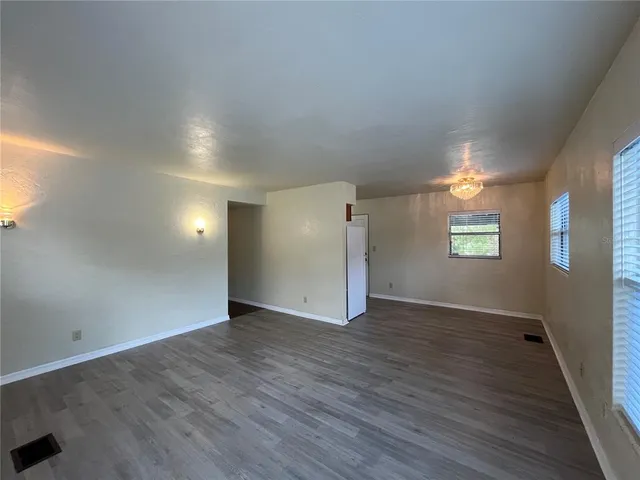 a kitchen with a refrigerator and a stove top oven