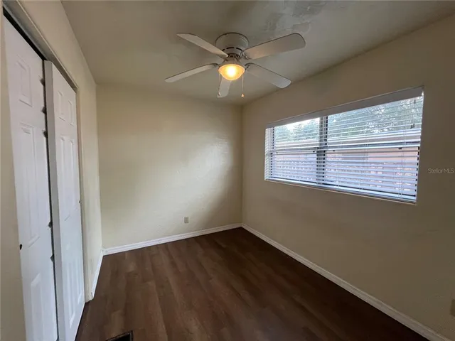 a kitchen with a white stove and refrigerator