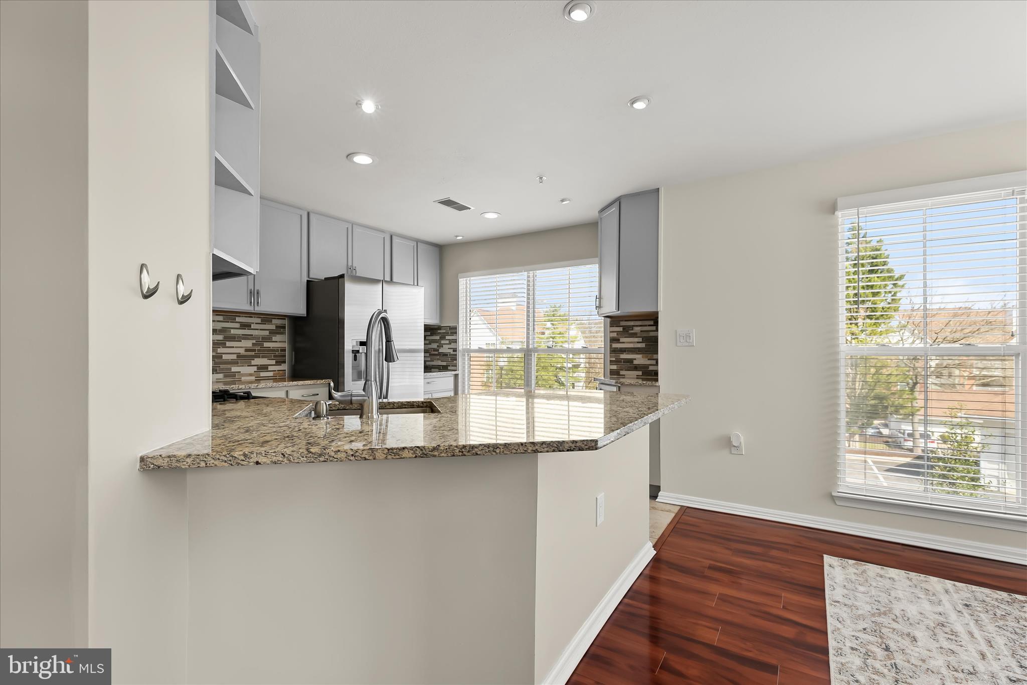 3555 Floating Leaf Lane, Unit C201 Laurel, MD 20724 - Photo 12 of 37 a kitchen with stainless steel appliances a refrigerator and a stove top oven