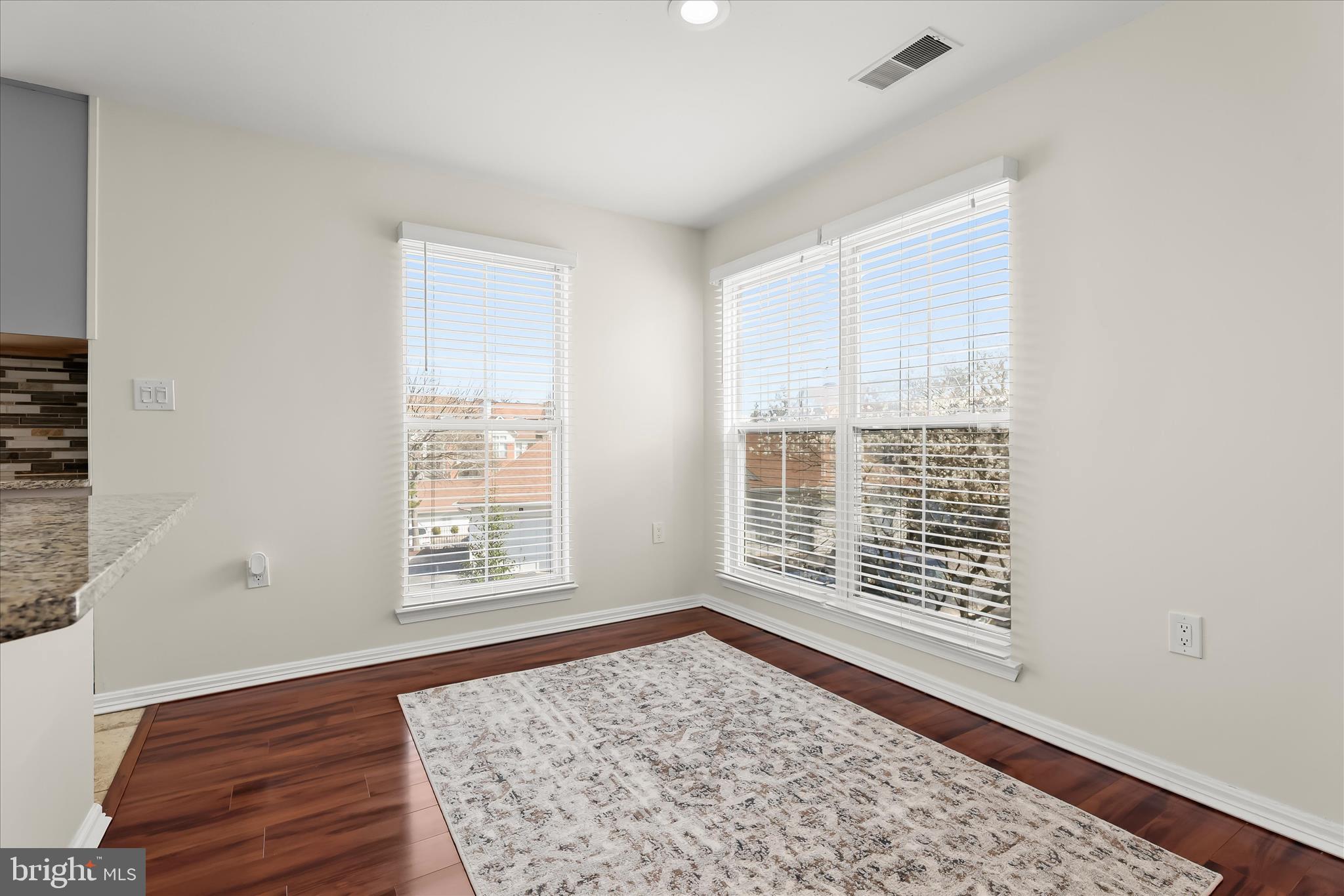 3555 Floating Leaf Lane, Unit C201 Laurel, MD 20724 - Photo 16 of 37 a view of an empty room with wooden floor and a window