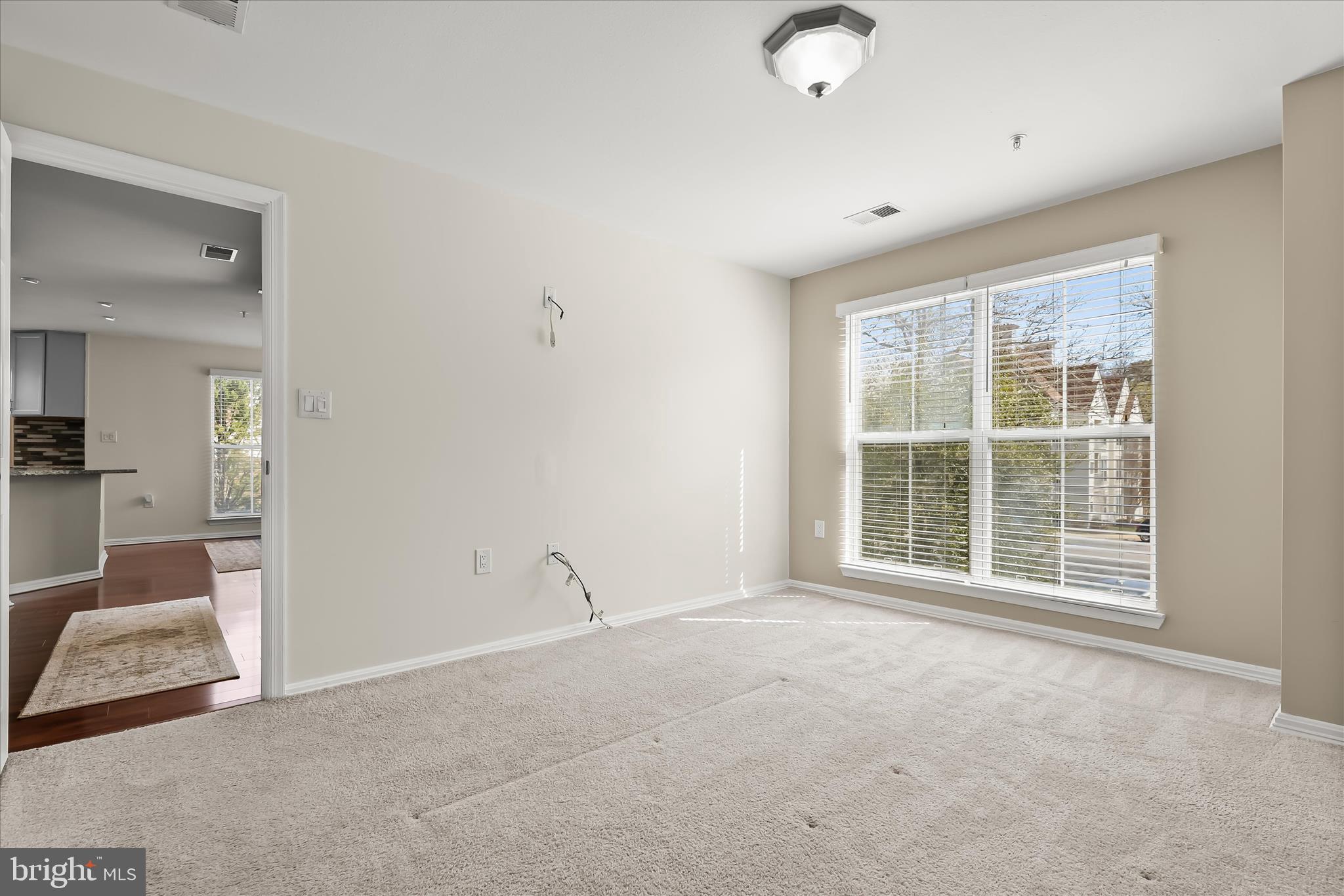 3555 Floating Leaf Lane, Unit C201 Laurel, MD 20724 - Photo 17 of 37 a view of an empty room with a window