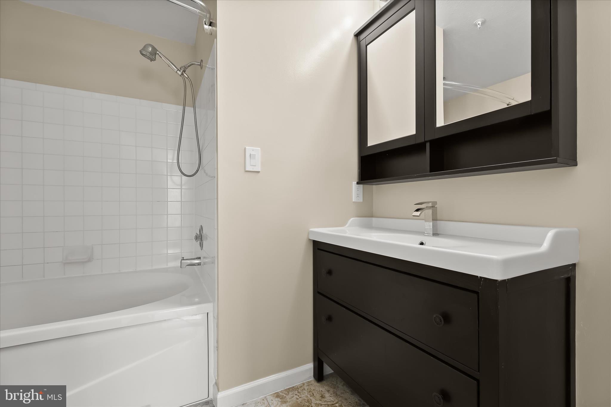 3555 Floating Leaf Lane, Unit C201 Laurel, MD 20724 - Photo 19 of 37 a bathroom with a sink and a mirror
