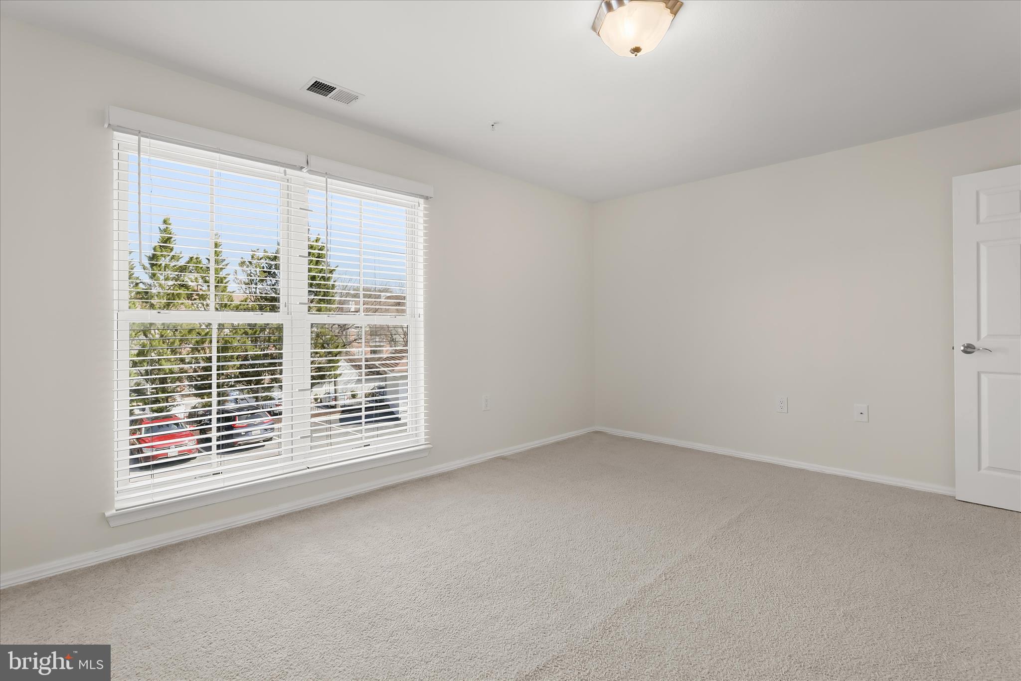 3555 Floating Leaf Lane, Unit C201 Laurel, MD 20724 - Photo 22 of 37 a view of an empty room with a window