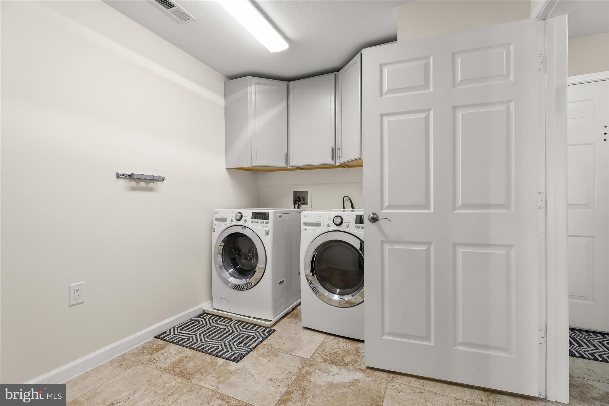 3555 Floating Leaf Lane, Unit C201 Laurel, MD 20724 - Photo 25 of 37 a utility room with sink dryer and washer