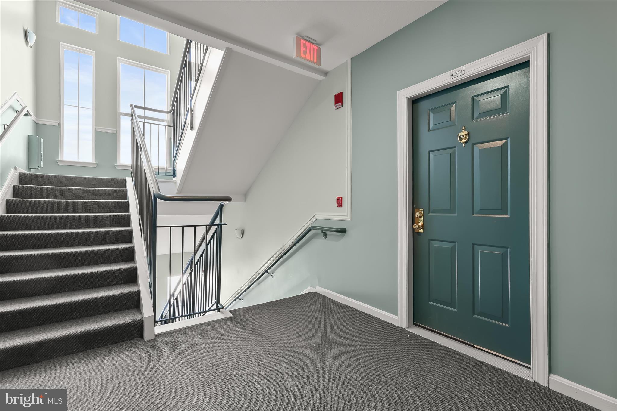 3555 Floating Leaf Lane, Unit C201 Laurel, MD 20724 - Photo 27 of 37 a view of a hallway with windows and stairs