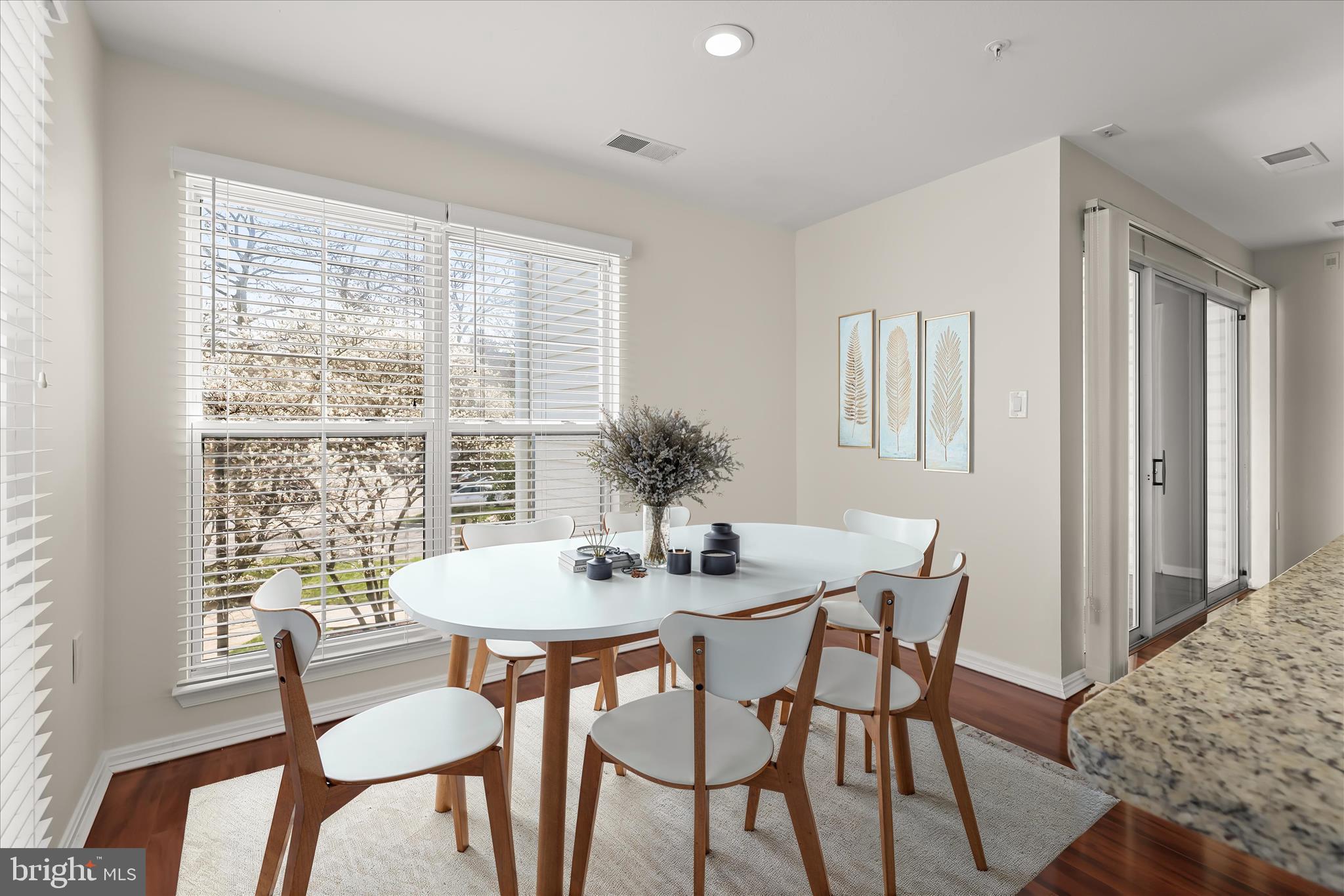 3555 Floating Leaf Lane, Unit C201 Laurel, MD 20724 - Photo 4 of 37 a view of a dining room with furniture and wooden floor