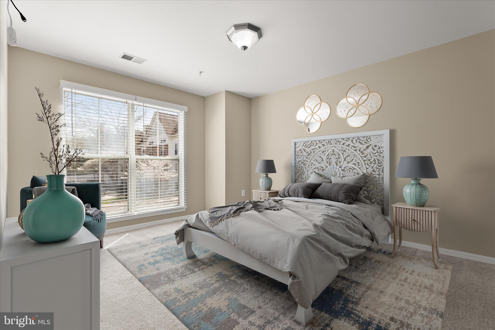 3555 Floating Leaf Lane, Unit C201 Laurel, MD 20724 - Photo 5 of 37 a bedroom with a bed mirror and window