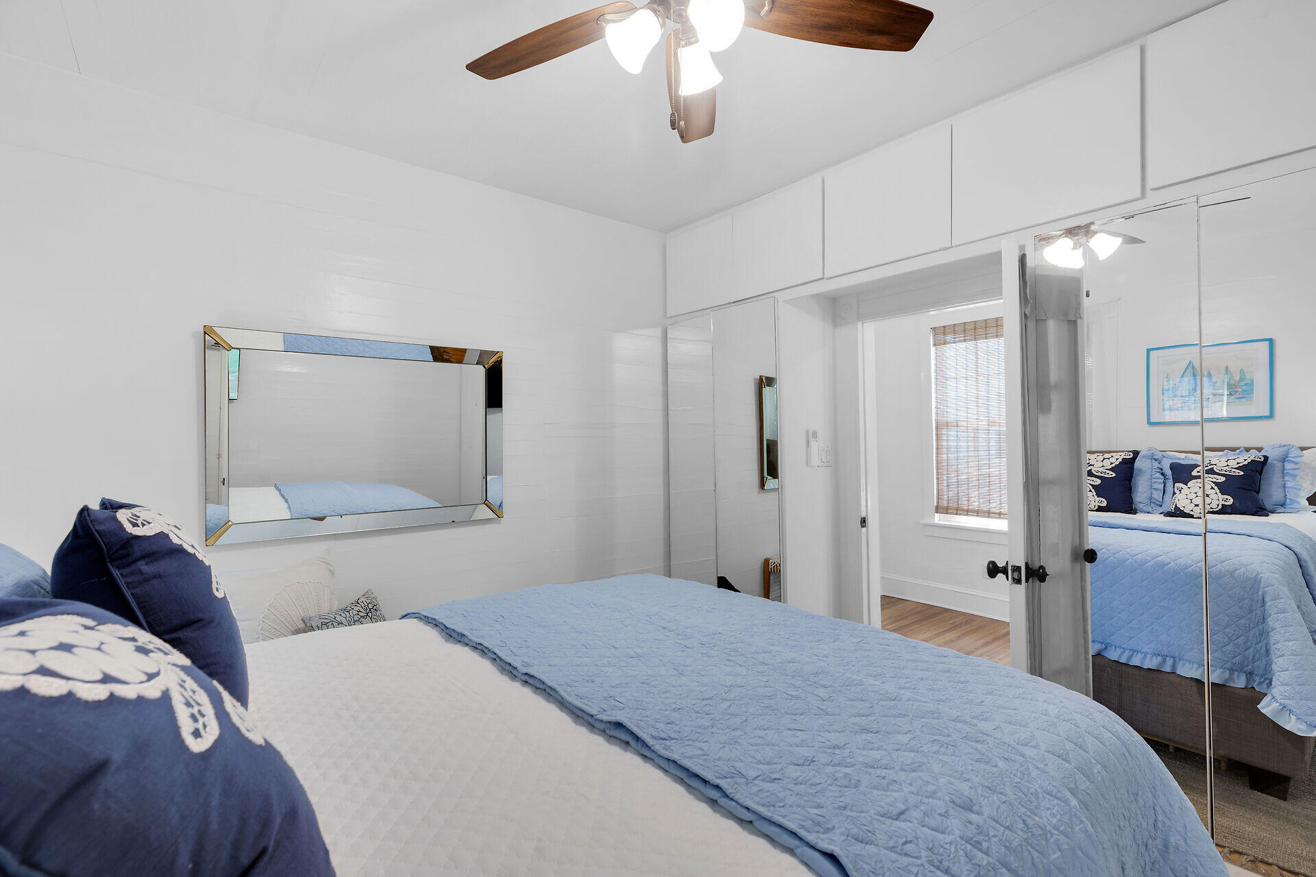 1022 Fleming Street Key West, FL 33040 - Photo 26 of 58 a bedroom with a bed and a chandelier