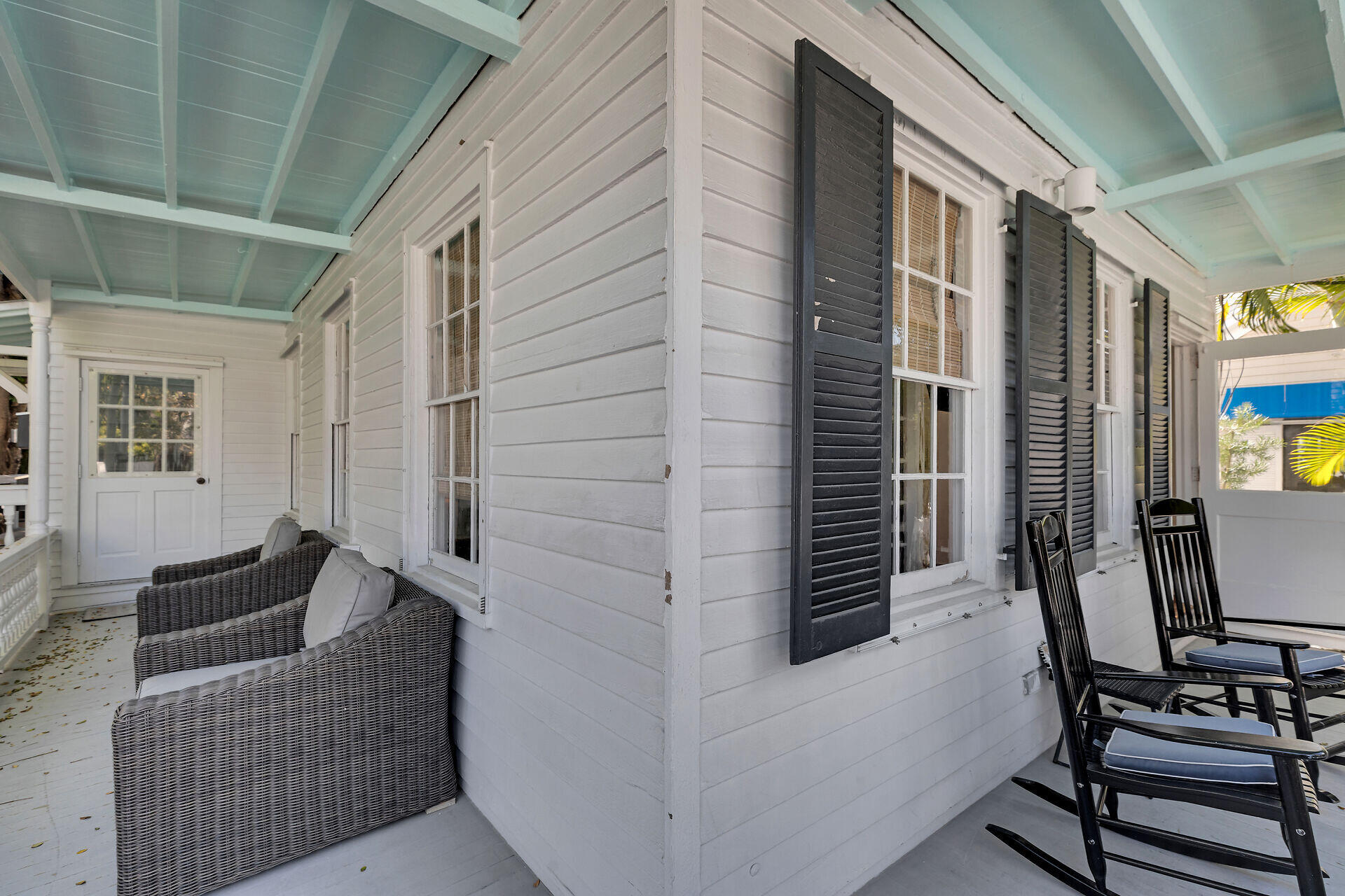 1022 Fleming Street Key West, FL 33040 - Photo 58 of 58 a balcony with furniture and a potted plant