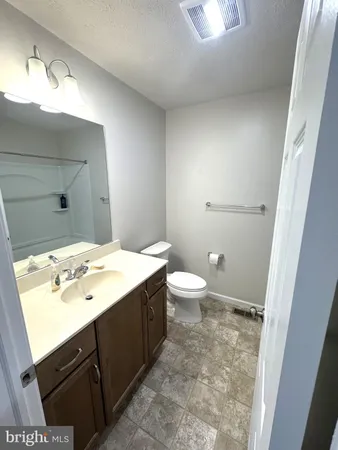 a bathroom with a sink and a shower