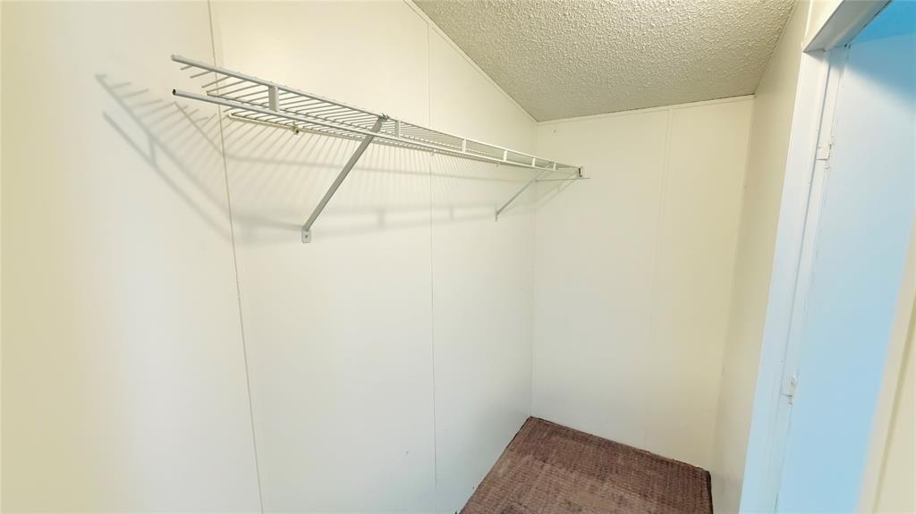 3789 Jacobs Lane Kaufman, TX 75142 - Photo 17 of 33 a view of a room with racks on the wall