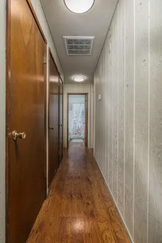 a view of hallway with bathroom