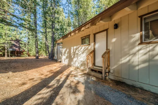 a view of a house with a tree