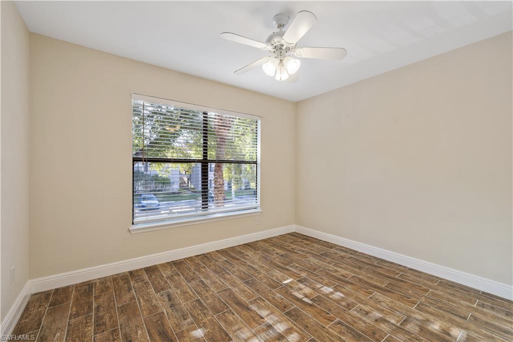 2142 Arbour Walk Circle, Unit 2626 Naples, FL 34109 - Photo 11 of 20 an empty room with a window