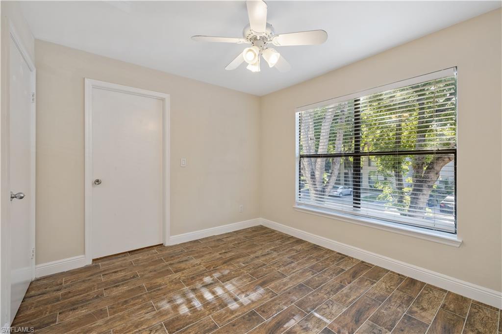 2142 Arbour Walk Circle, Unit 2626 Naples, FL 34109 - Photo 12 of 20 a view of an empty room with a window