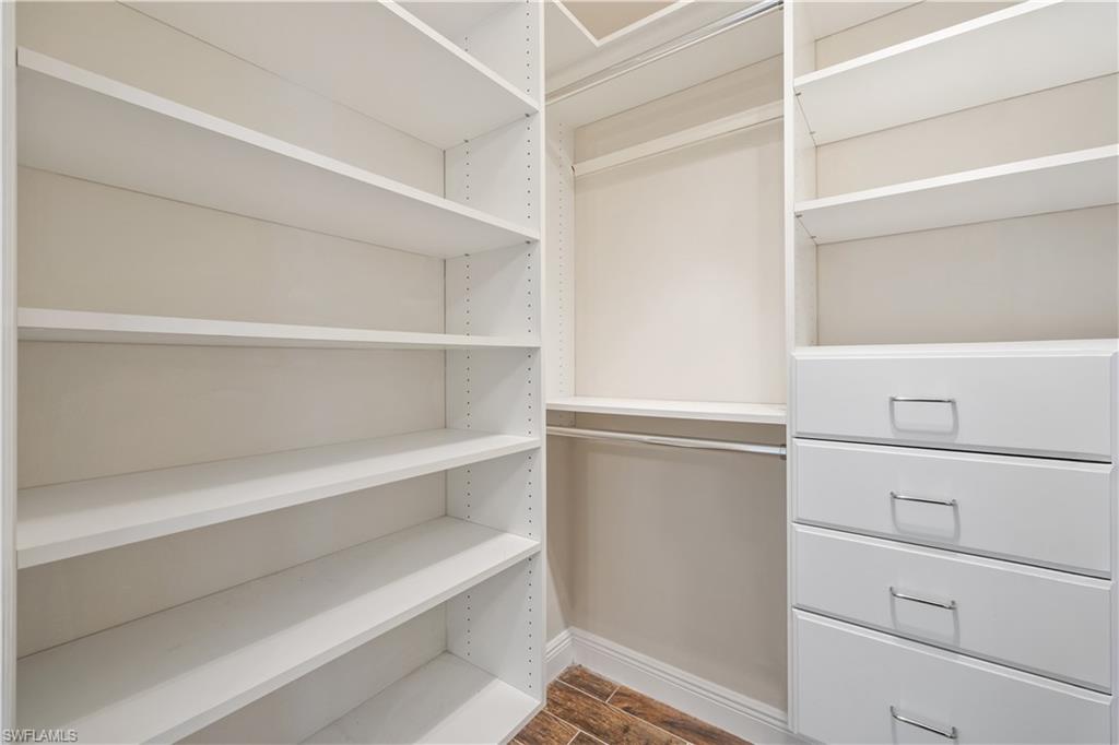 2142 Arbour Walk Circle, Unit 2626 Naples, FL 34109 - Photo 13 of 20 a view of an empty walk in closet