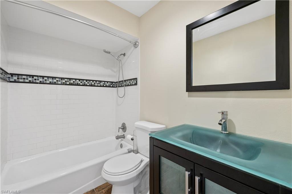 2142 Arbour Walk Circle, Unit 2626 Naples, FL 34109 - Photo 14 of 20 a bathroom with a sink a toilet and shower