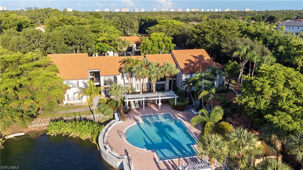 2142 Arbour Walk Circle, Unit 2626 Naples, FL 34109 - Photo 17 of 20 an aerial view of a house with a swimming pool