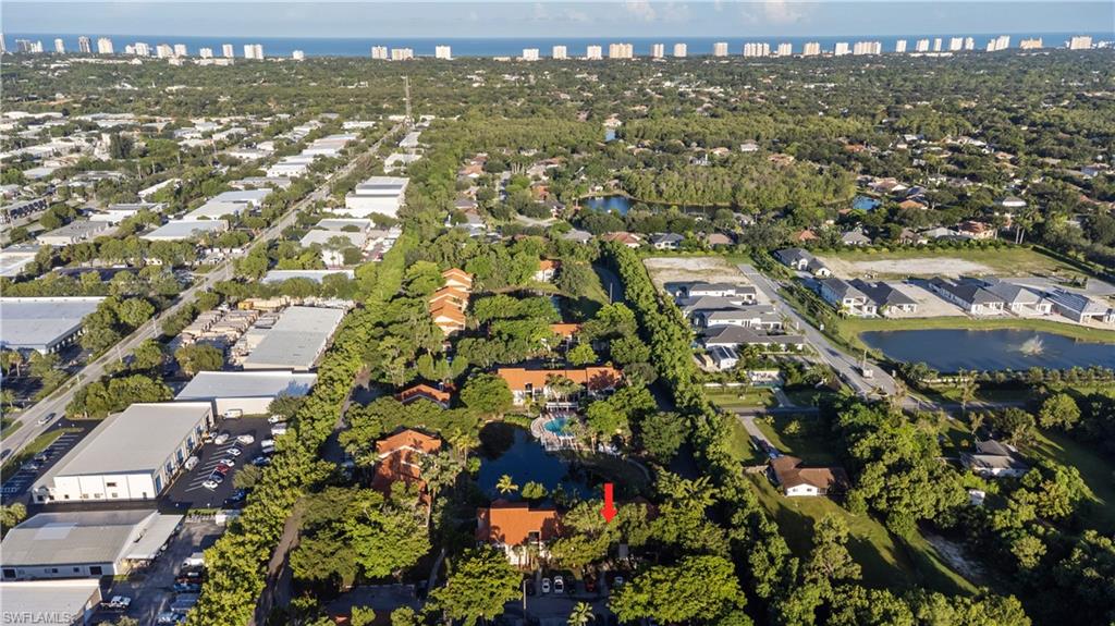2142 Arbour Walk Circle, Unit 2626 Naples, FL 34109 - Photo 19 of 20 an aerial view of residential houses with city view
