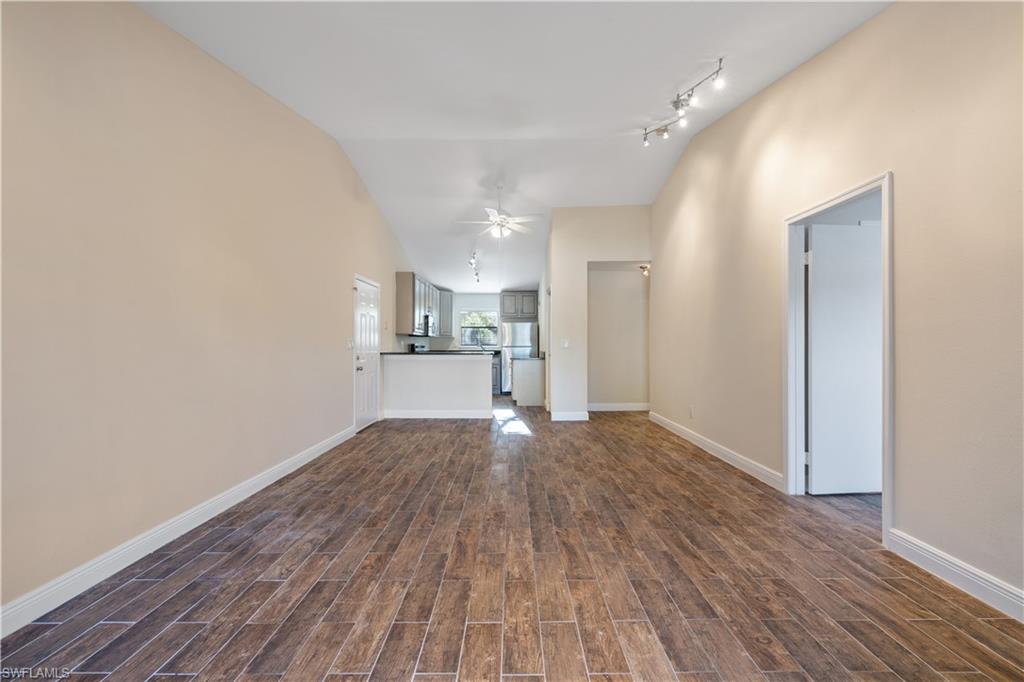 2142 Arbour Walk Circle, Unit 2626 Naples, FL 34109 - Photo 3 of 20 a view of empty room with wooden floor