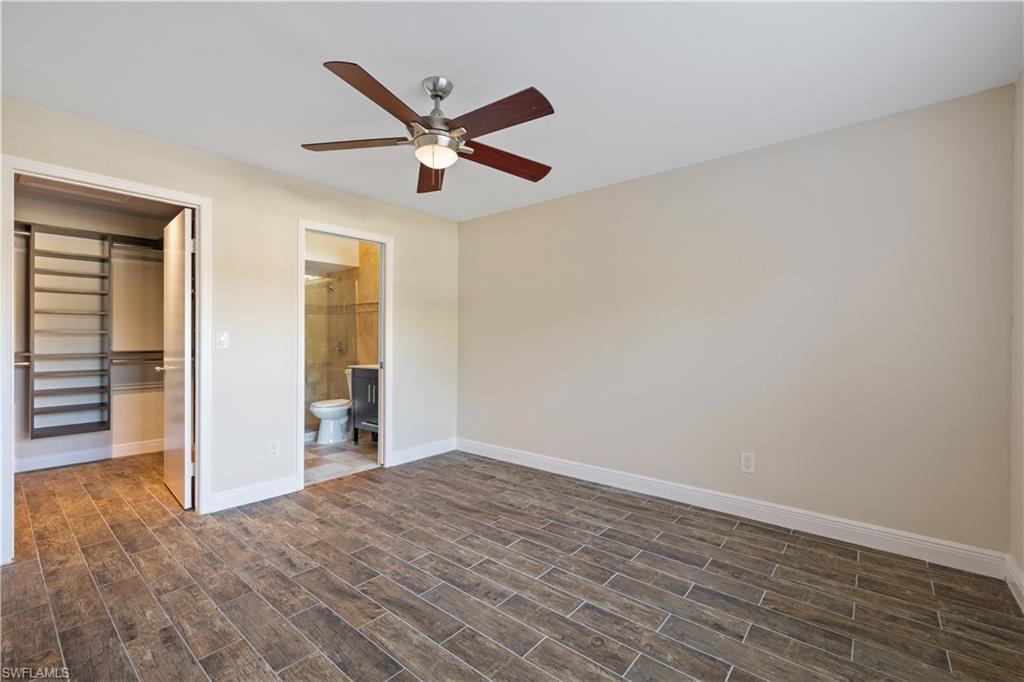 2142 Arbour Walk Circle, Unit 2626 Naples, FL 34109 - Photo 8 of 20 a view of empty room with wooden floor