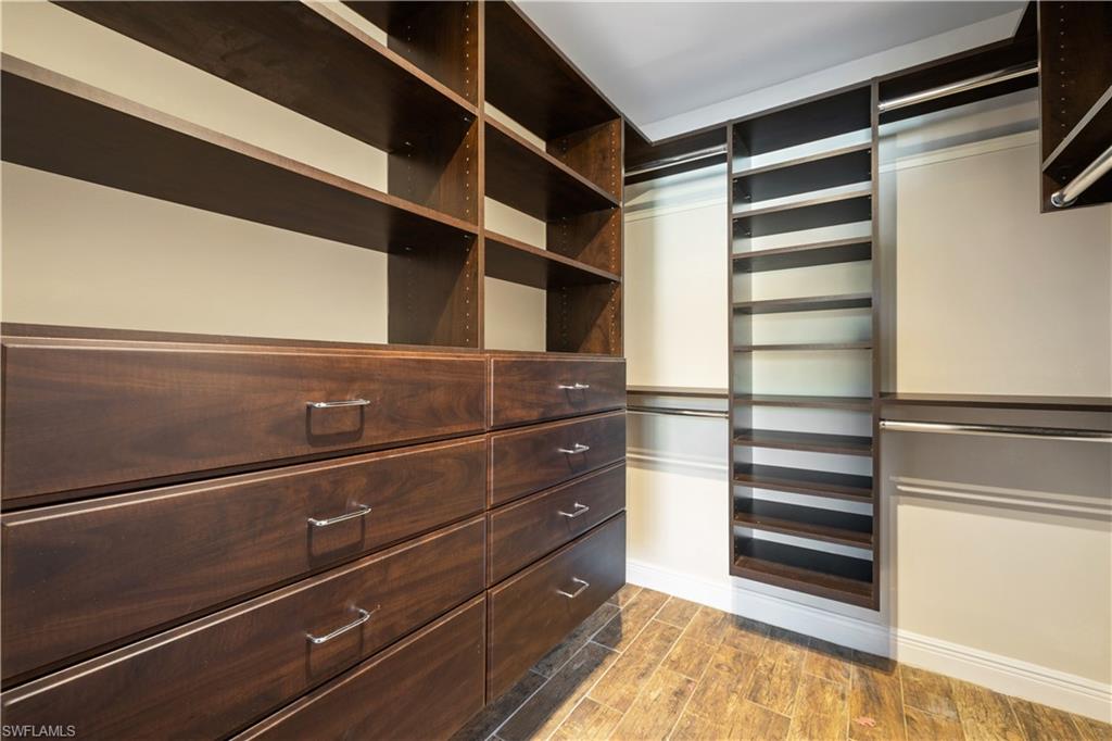 2142 Arbour Walk Circle, Unit 2626 Naples, FL 34109 - Photo 9 of 20 a view of walk in closet with empty racks