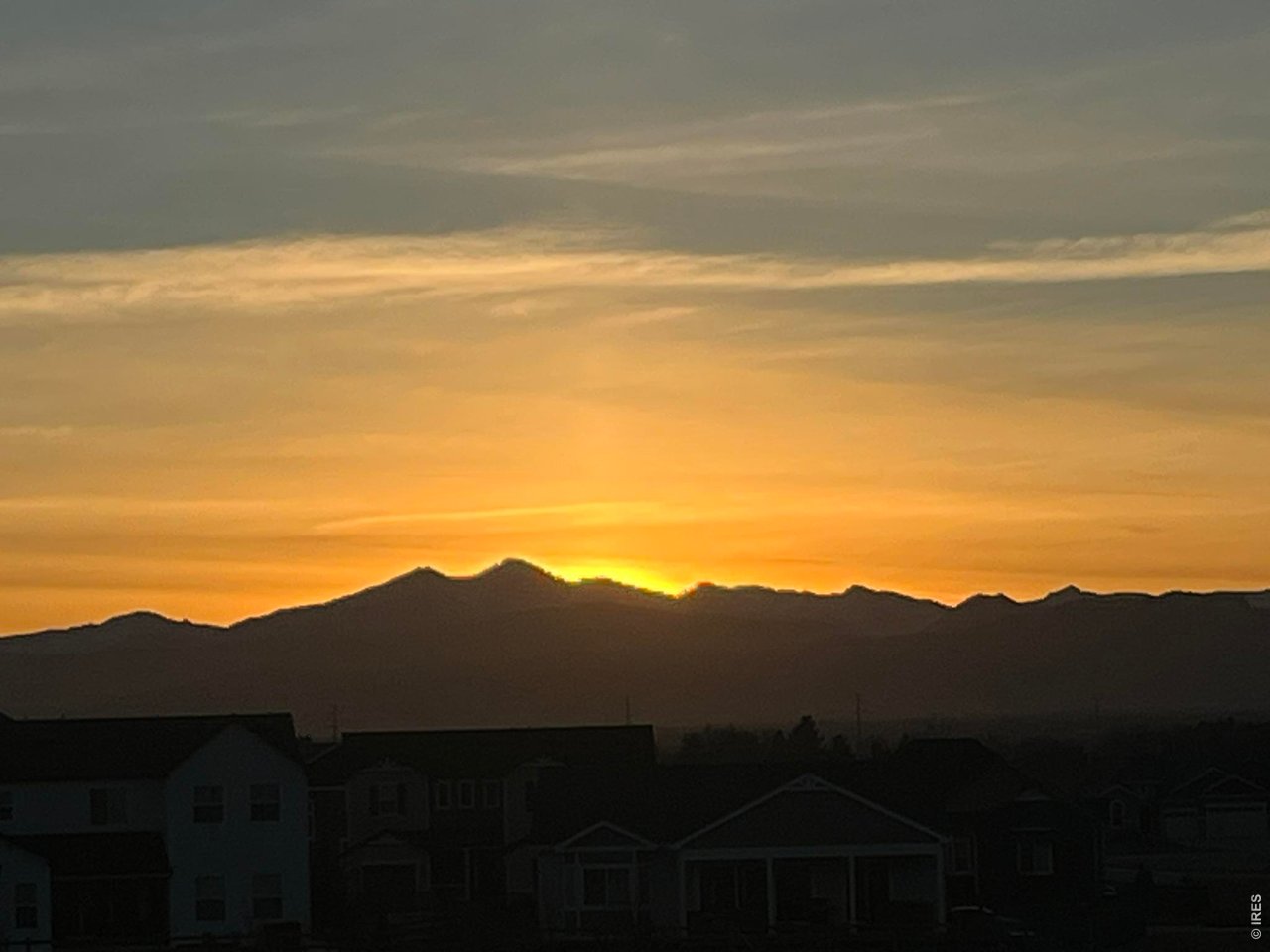 5531 Teeling Court Timnath, CO 80547 - Photo 12 of 48 a view of a large mountains with an ocean in the background