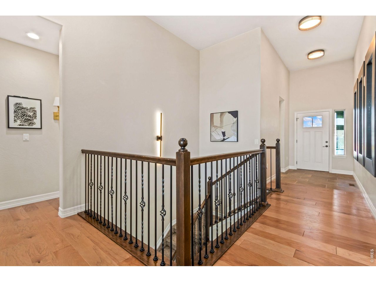 5531 Teeling Court Timnath, CO 80547 - Photo 16 of 48 a view of a hallway with wooden floor