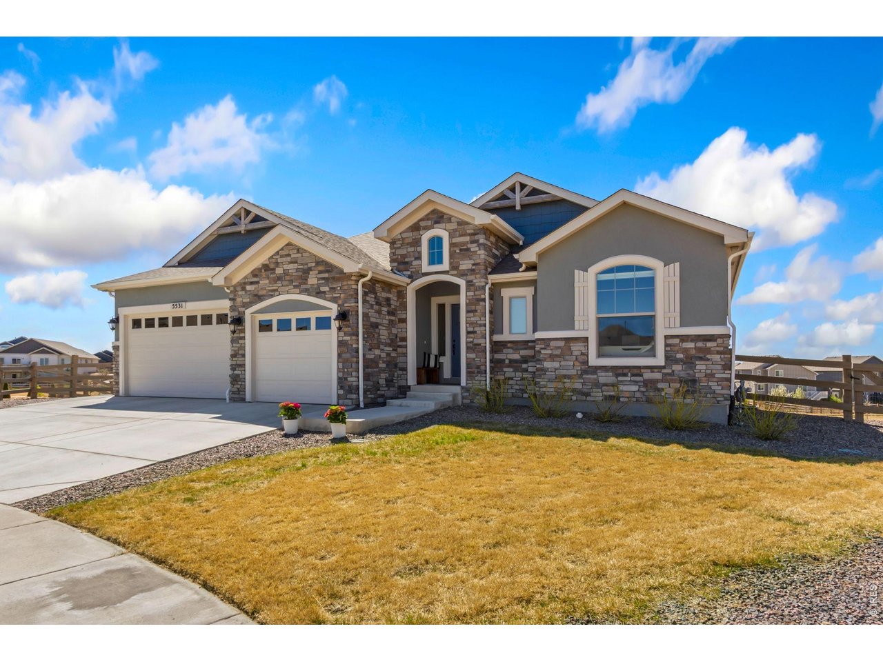 5531 Teeling Court Timnath, CO 80547 - Photo 2 of 48 a front view of a house with a yard