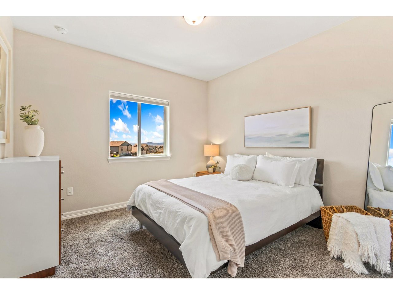 5531 Teeling Court Timnath, CO 80547 - Photo 20 of 48 a bedroom with a bed and a painting on the wall