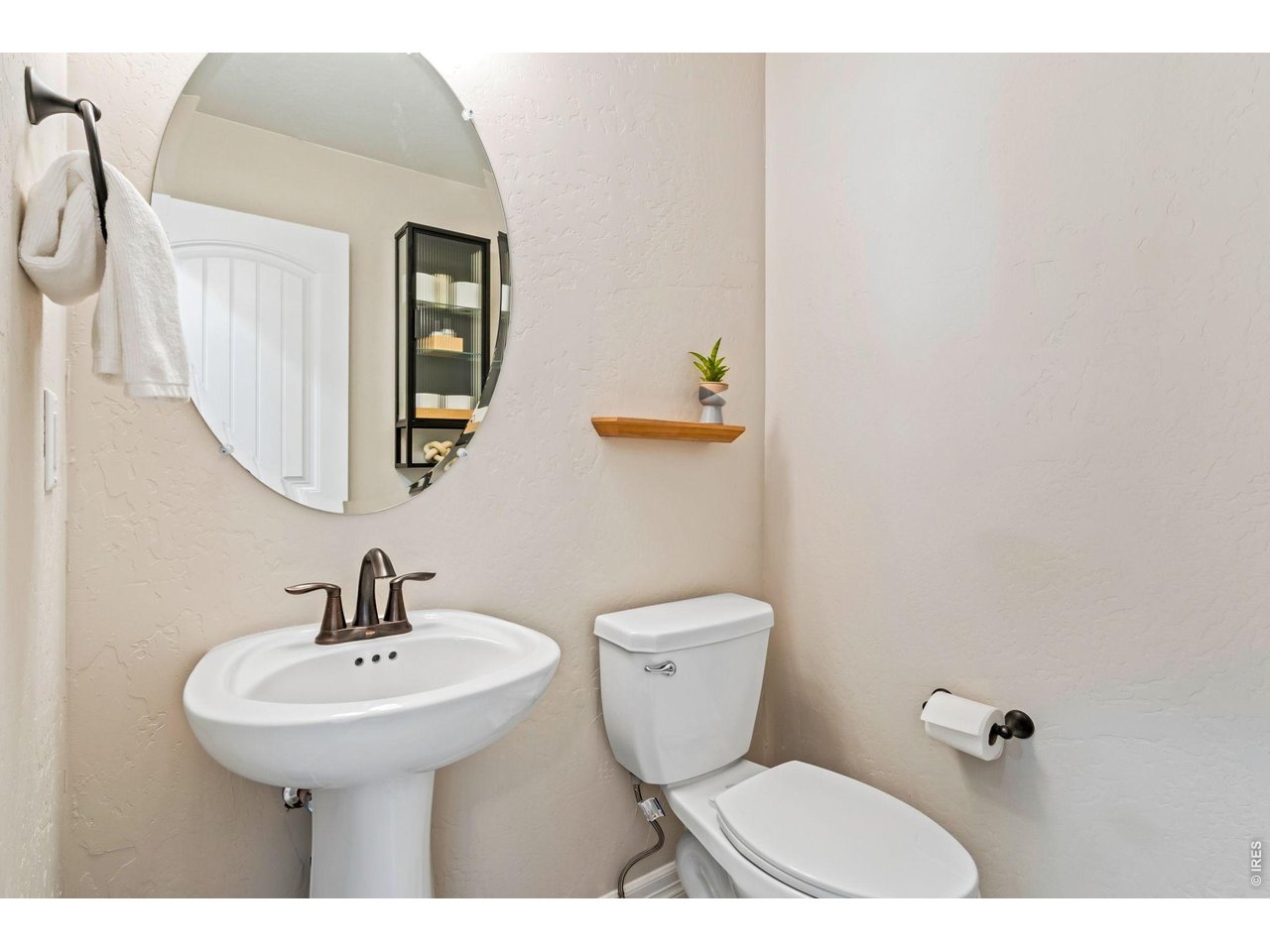 5531 Teeling Court Timnath, CO 80547 - Photo 25 of 48 a bathroom with a toilet a sink and mirror