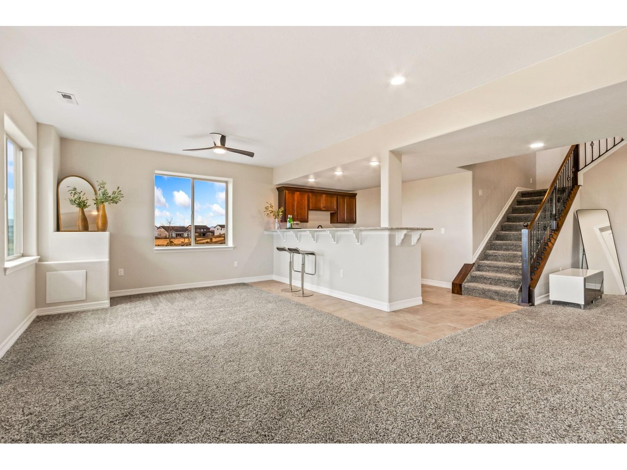 5531 Teeling Court Timnath, CO 80547 - Photo 27 of 48 a view of a livingroom with furniture staircase and windows