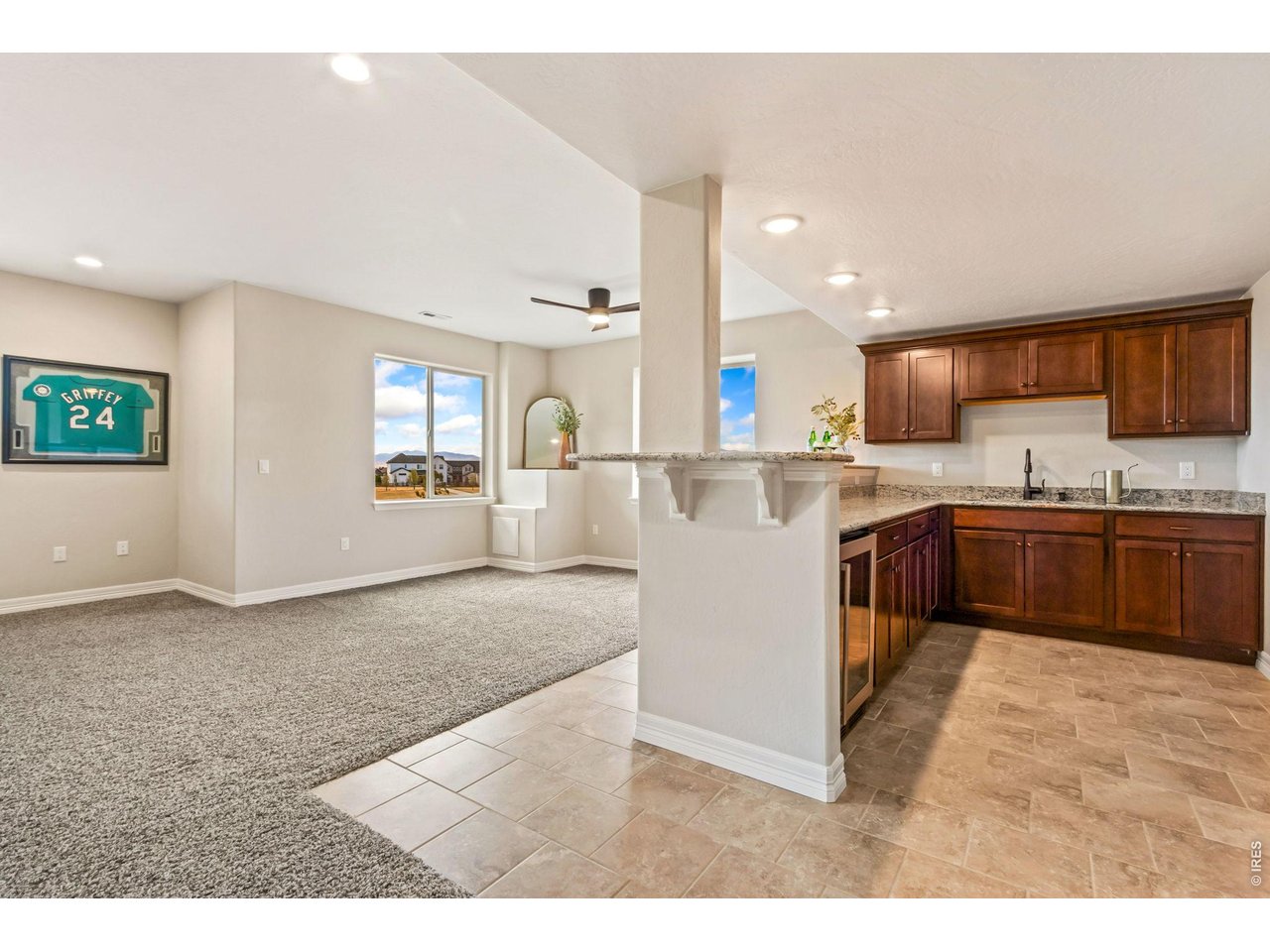 5531 Teeling Court Timnath, CO 80547 - Photo 28 of 48 a kitchen with stainless steel appliances granite countertop a refrigerator sink and cabinets