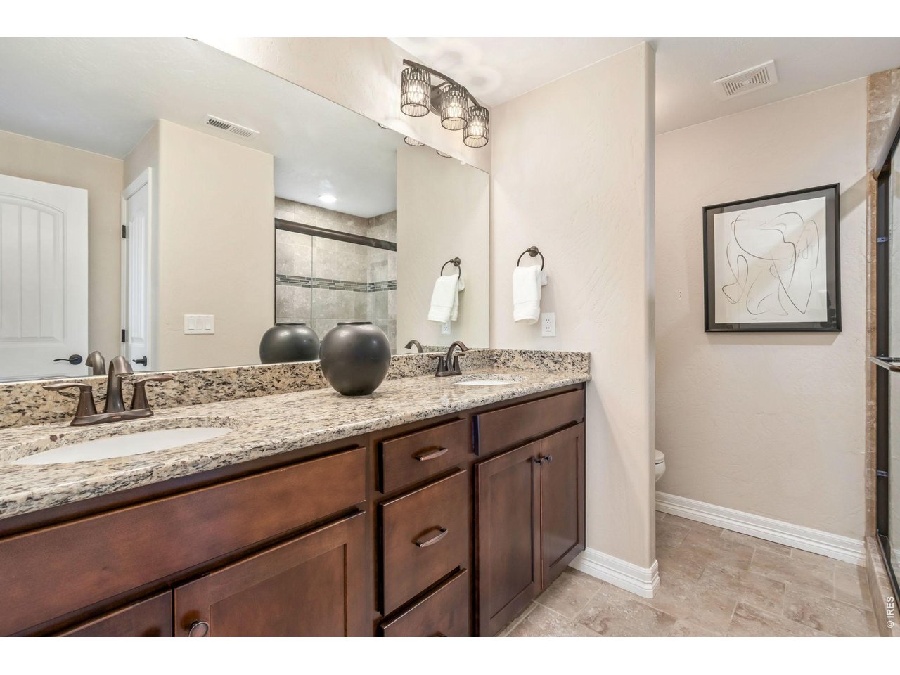5531 Teeling Court Timnath, CO 80547 - Photo 37 of 48 a bathroom with a granite countertop sink mirror and double