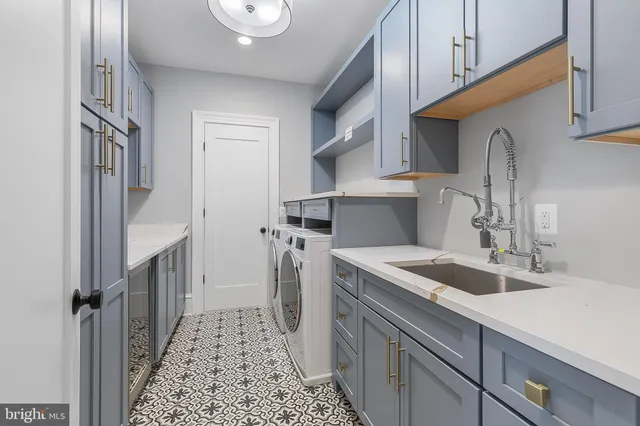 a kitchen with a sink and a refrigerator