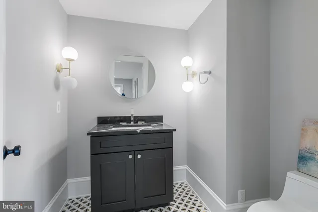 a bathroom with a toilet and a sink