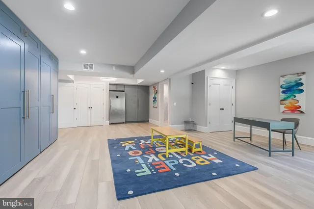 a living room with a rug and a table