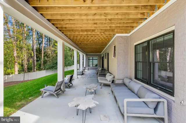 a view of a patio with wooden floor